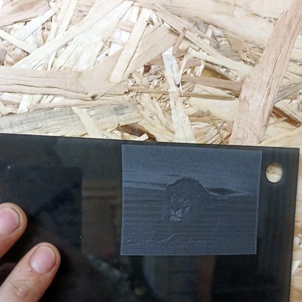 Black acrylic with an engraved image