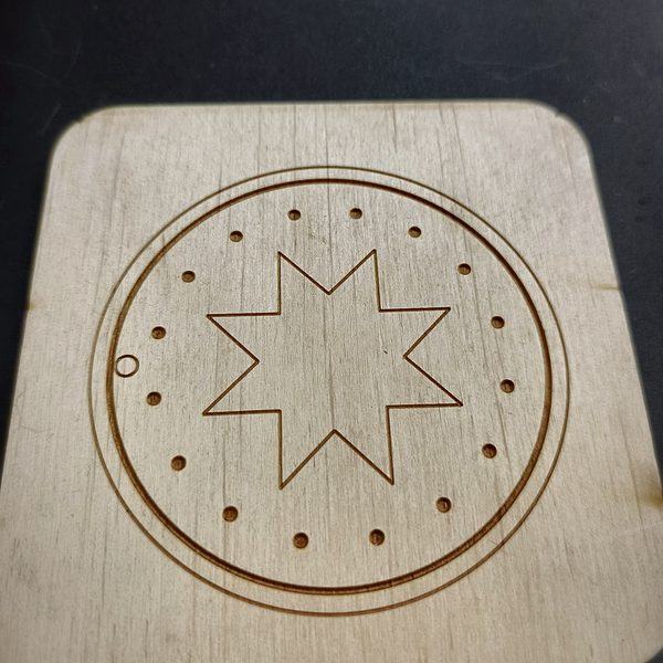 Plywood coaster — Auseklis star