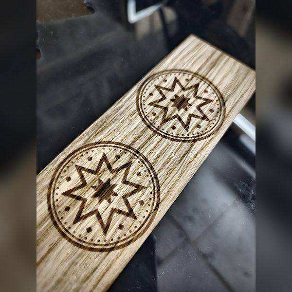 Wooden strip — close-up of the engraving
