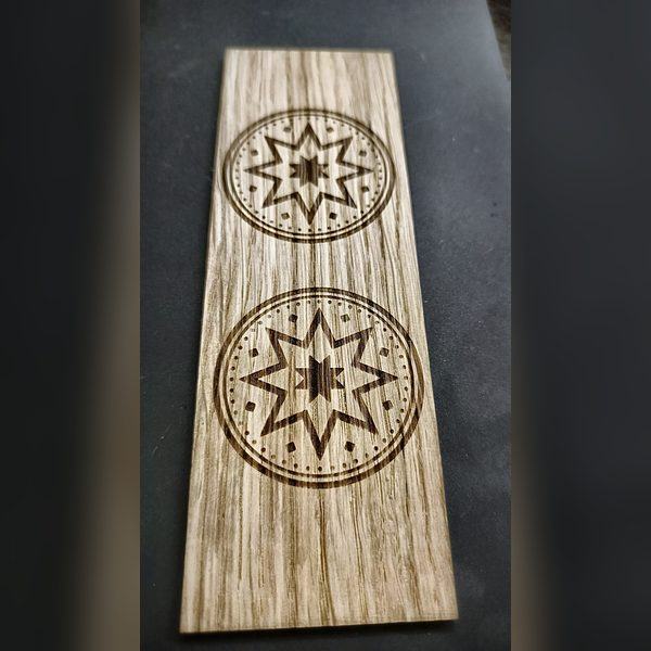 Wooden strip — two Auseklis medallions