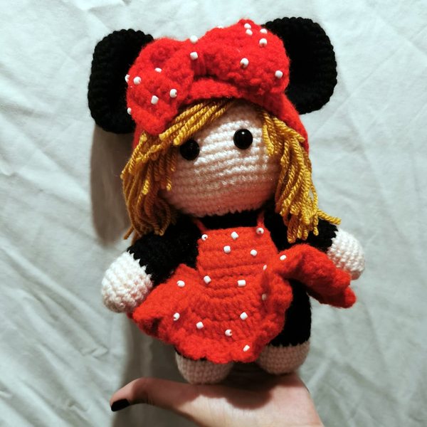 Crocheted doll in a red dress